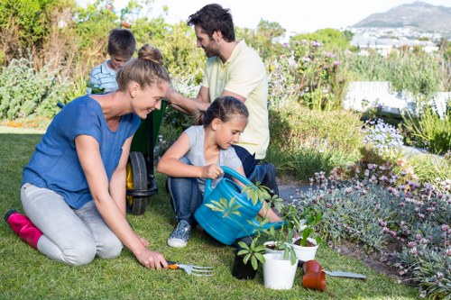 Gardeners Poplar improving a local garden with seasonal care